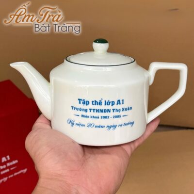 bo-am-chen-ve-tay-in-logo-hoa-tiet-sen-xanh-vai-vuong-men-kem-atbt-vt15 (4)